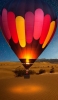 📱砂漠の上を飛ぶ気球 iPhone 14 Pro 壁紙・待ち受け