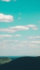 📱綺麗な青い空と海と山 iPhone 14 壁紙・待ち受け