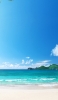 📱綺麗な夏空とビーチ iPhone 14 Pro Max 壁紙・待ち受け