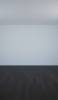 📱白い壁 黒い木の床 iPhone 14 Pro Max 壁紙・待ち受け
