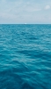 📱水色の大海原 遠くに見える白い船 Xperia 5 IV 壁紙・待ち受け