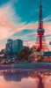 📱夕暮れ時の東京タワー iPhone 14 壁紙・待ち受け