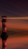 📱夜の海を照らす赤と白の灯台 Redmi 9T Android 壁紙・待ち受け
