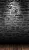 📱黒のレンガの壁と古びた木のフロアー Galaxy A30 Android 壁紙・待ち受け