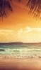 📱砂浜と綺麗な海と夕焼け iPhone 12 mini 壁紙・待ち受け