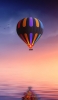 📱夜 海の上を飛ぶカラフルな気球 Find X Android 壁紙・待ち受け