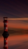 📱夕暮れ時の海の灯台 iPhone 11 Pro 壁紙・待ち受け