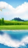 📱湖に映る雲と丘と桜 iPhone 12 Pro 壁紙・待ち受け