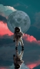 📱満月と宇宙飛行士 iPhone 12 Pro 壁紙・待ち受け