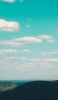 📱山越しの海、綺麗な青い空 iPhone 12 Pro 壁紙・待ち受け