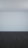 📱白い壁 黒い木の床 iPhone 13 Pro Max 壁紙・待ち受け