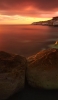📱夕焼け 赤い海 大きな岩 iPhone SE (第1世代) 壁紙・待ち受け