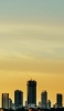 📱黄色いグラデーションの空 高層ビル群 iPhone 5 壁紙・待ち受け