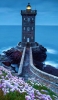 📱綺麗な紫の花畑 レンガの灯台 海 iPhone SE (第1世代) 壁紙・待ち受け