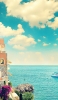 📱快晴時の綺麗な空と海と建物 iPhone SE (第3世代) 壁紙・待ち受け