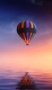 📱夕暮れの空とカラフルな気球 iPhone SE (第3世代) 壁紙・待ち受け