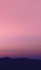 📱淡いピンクの空と山のシルエット Galaxy S21 5G 壁紙・待ち受け