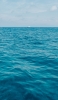 📱水色の大海原 遠くに見える白い船 Xperia 5 壁紙・待ち受け