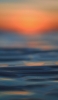 📱海面とぼやけた夕日 ZenFone 7 Pro 壁紙・待ち受け