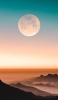 📱満月 淡い青・オレンジのグラデーションの空 山 Redmi Note 10 Pro 壁紙・待ち受け
