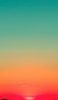 📱緑とオレンジのグラデーションの空 夕日 ZenFone 7 Pro 壁紙・待ち受け